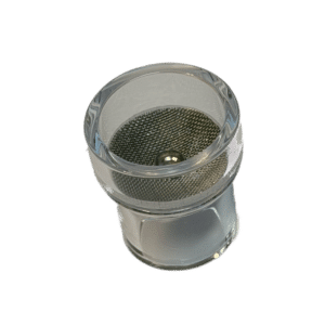 A Gaslins till FRK-kåpor, Lilla Linde visas ovanifrån: det är en klar cylindrisk behållare med en metallnätskärm och en liten metallkula inuti på en vit bakgrund.